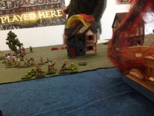 Playtest photo. The English land in the lower town, setting afire a waterfront building and a ship